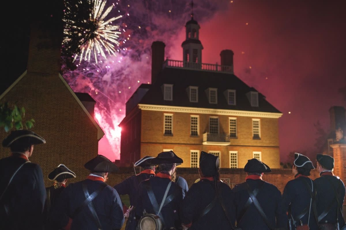 Colonial soldiers watching fireworks go off on the 4th of July