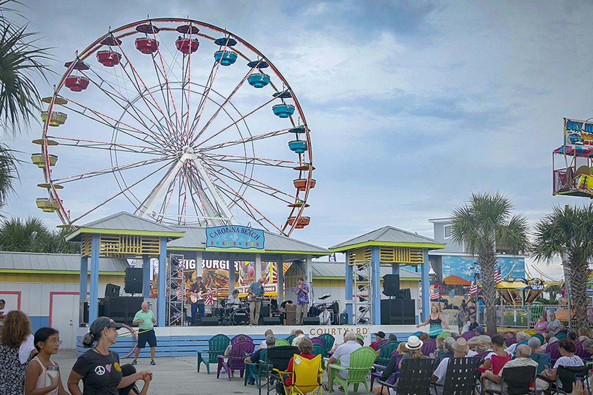 Carolina Beach Boardwalk Summer Entertainment with Ferris Wheel in background