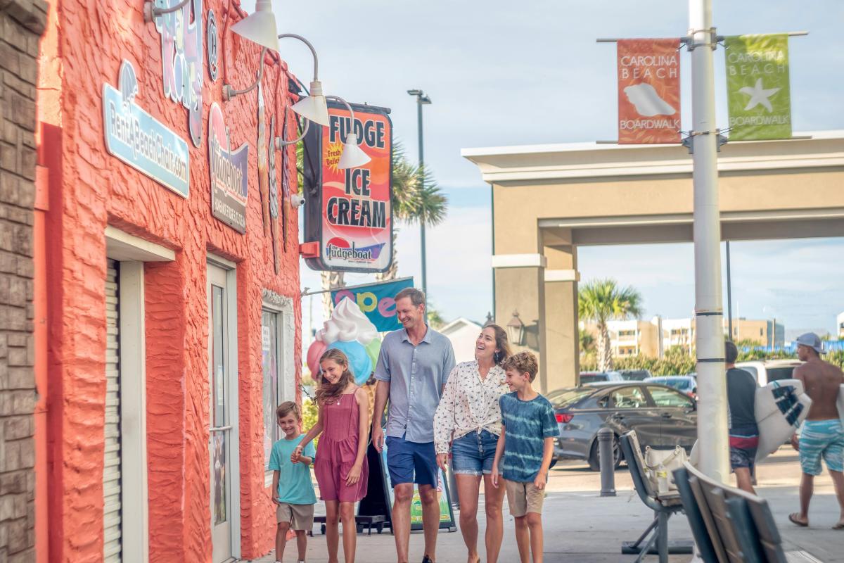 Family walking on Carolina Beach Boardwalk