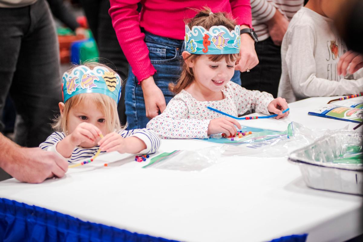 Kids coloring at The Cynthia Woods Mitchell Pavilion's Annual Children's Festival in The Woodlands, Texas