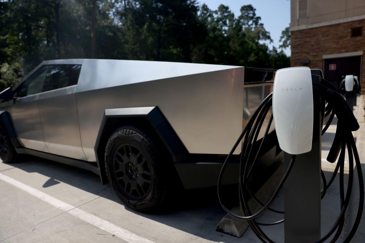 Tesla charger with Tesla truck in background at Hyatt Place in The Woodlands, Texas