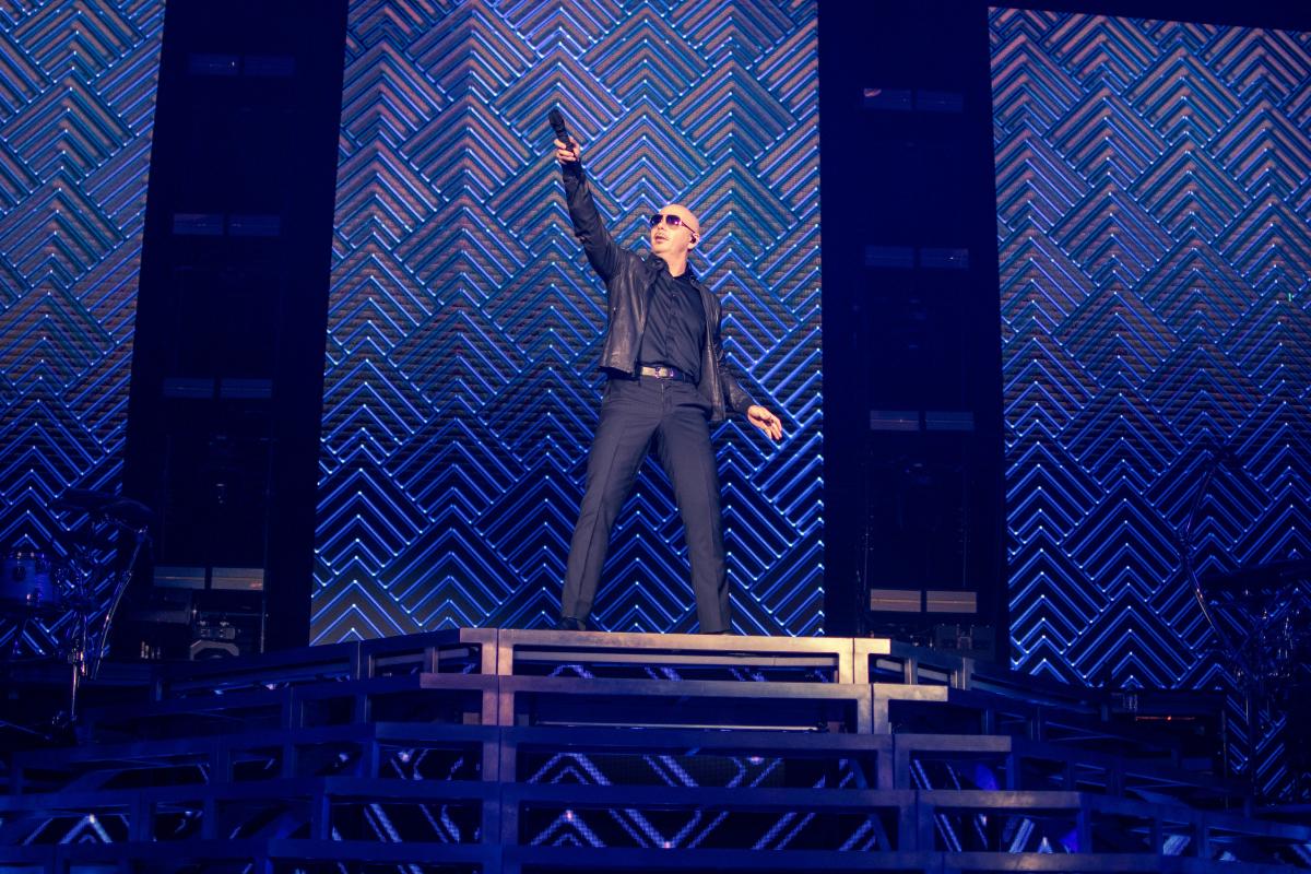 Pitbull performing at The Cynthia Woods Mitchell Pavilion