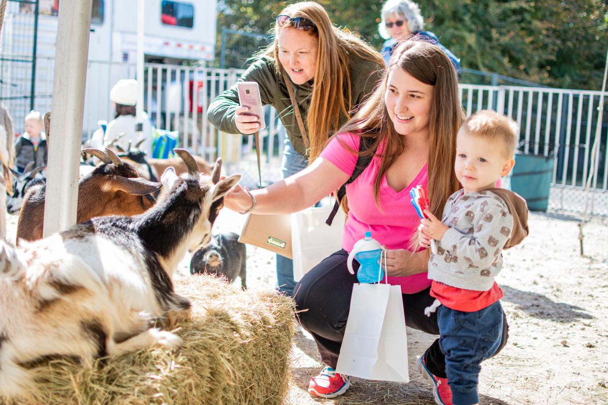 Mother and child at a petting zoo during The Children's Festival at The Cynthia Woods Mitchell Pavilion
