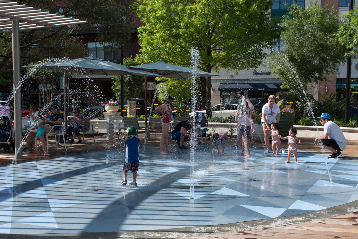 Child playing in the splash pad at Market Street