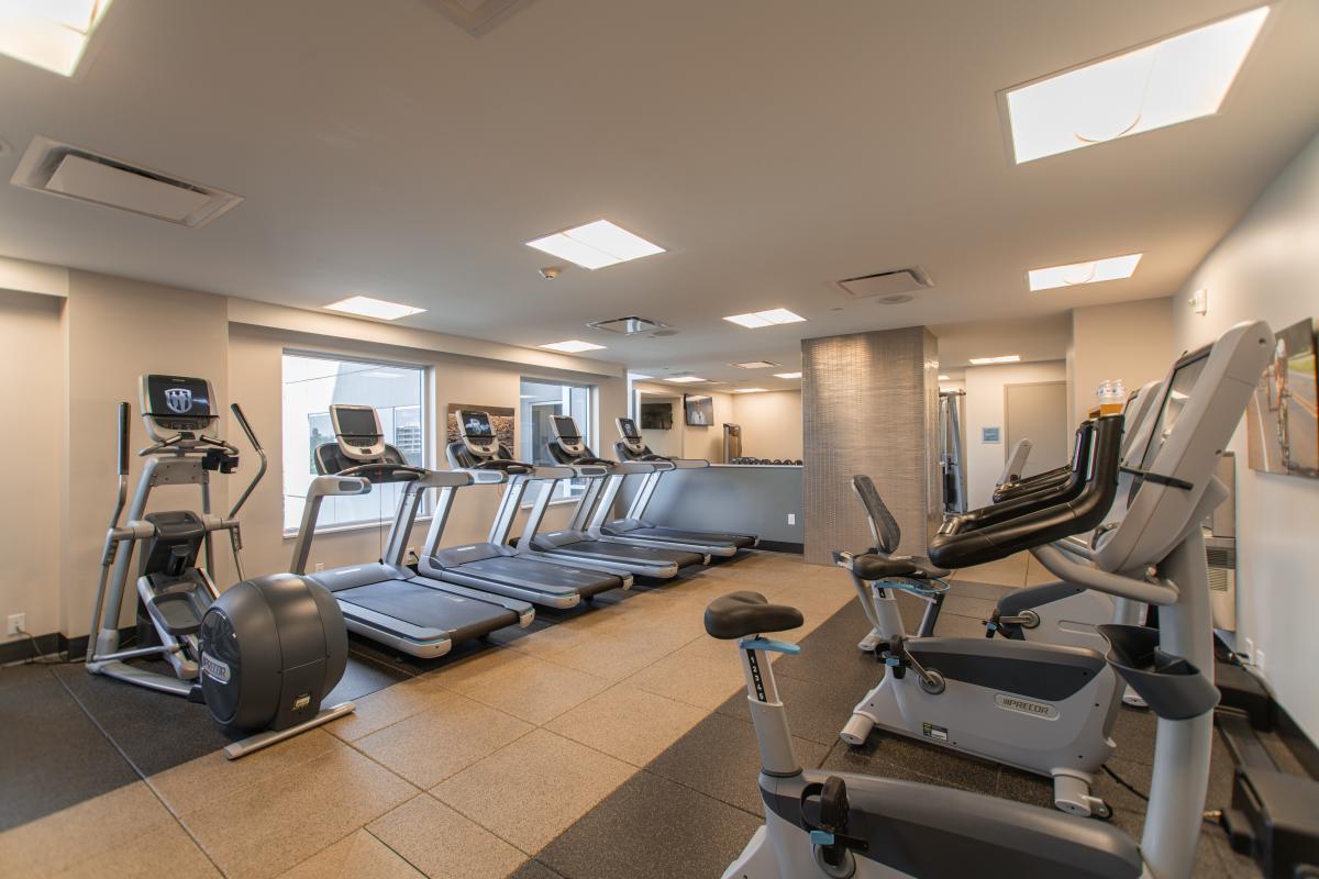 The Embassy Suites fitness center with treadmills, an elliptical and stationary bike