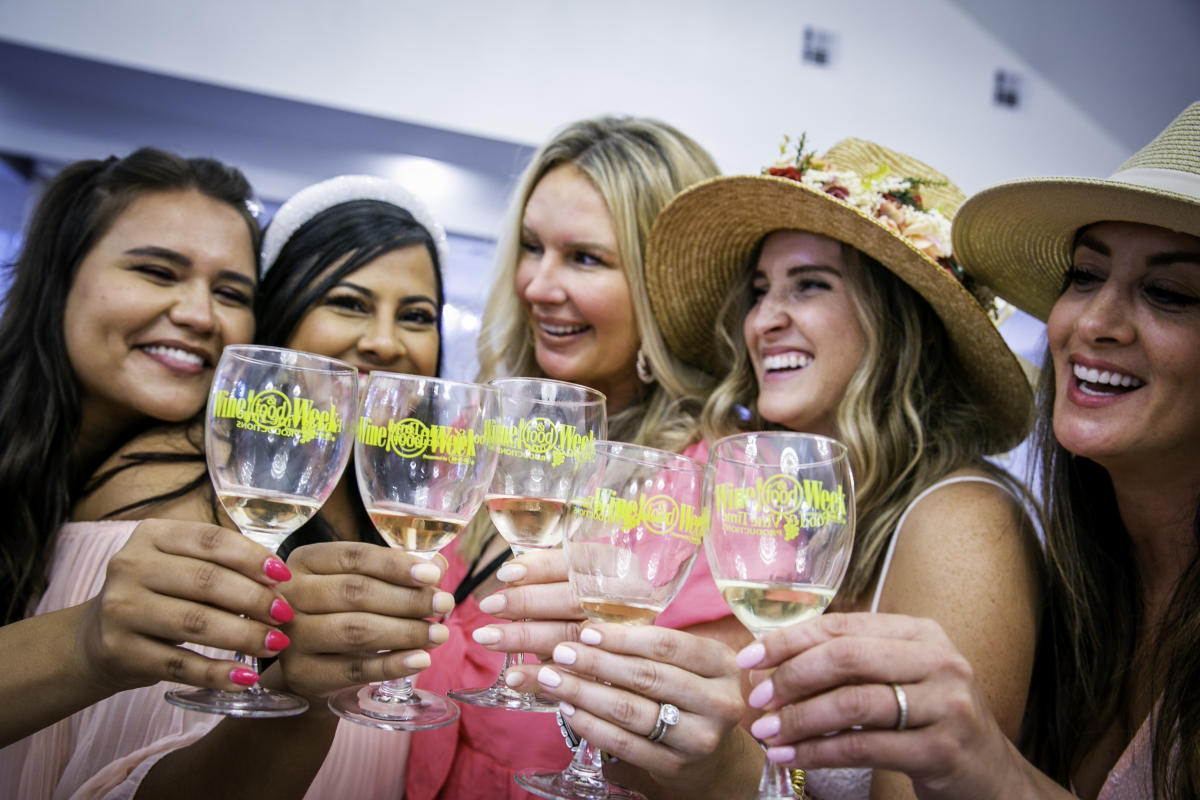 Girls with wine glasses at Wine & Food Week in The Woodlands, Texas