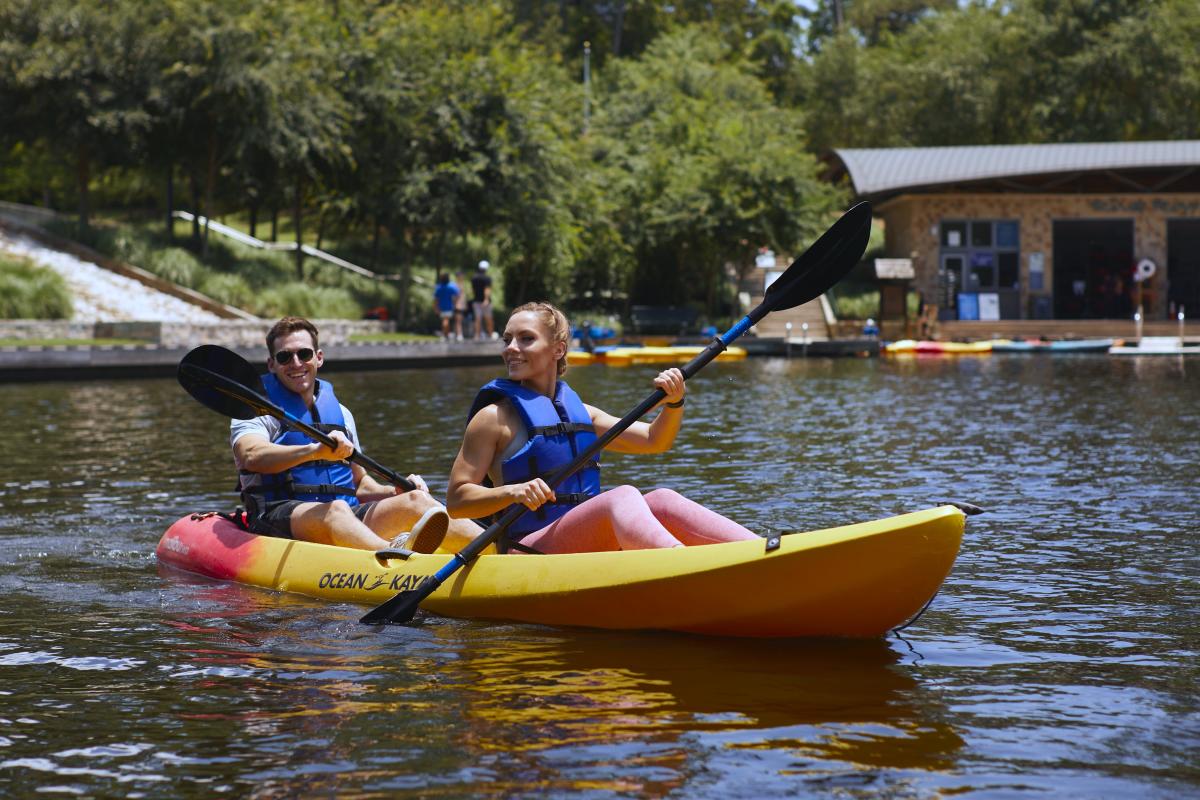 Couple kayaking on The Woodlands Waterway in The Woodlands, Texas