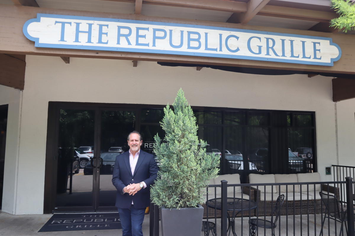 Terry McBurney in front of The Republic Grille in The Woodlands, Texas