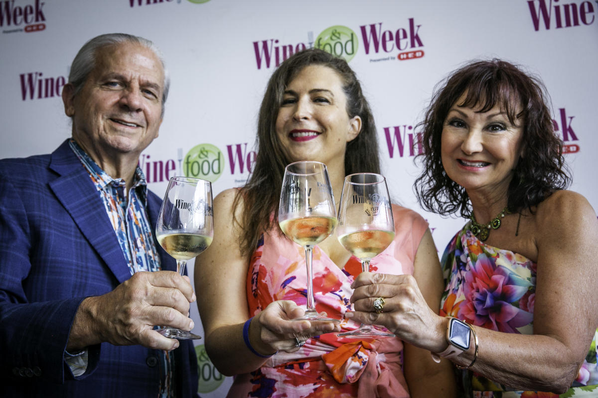 People holding wine glasses at Wine & Food Week in The Woodlands, Texas