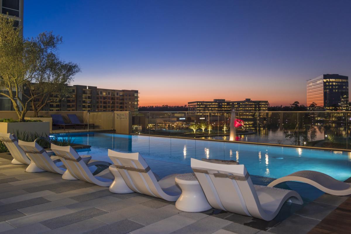 Sunset view of the Embassy Suites pool overlooking Hughes Landing