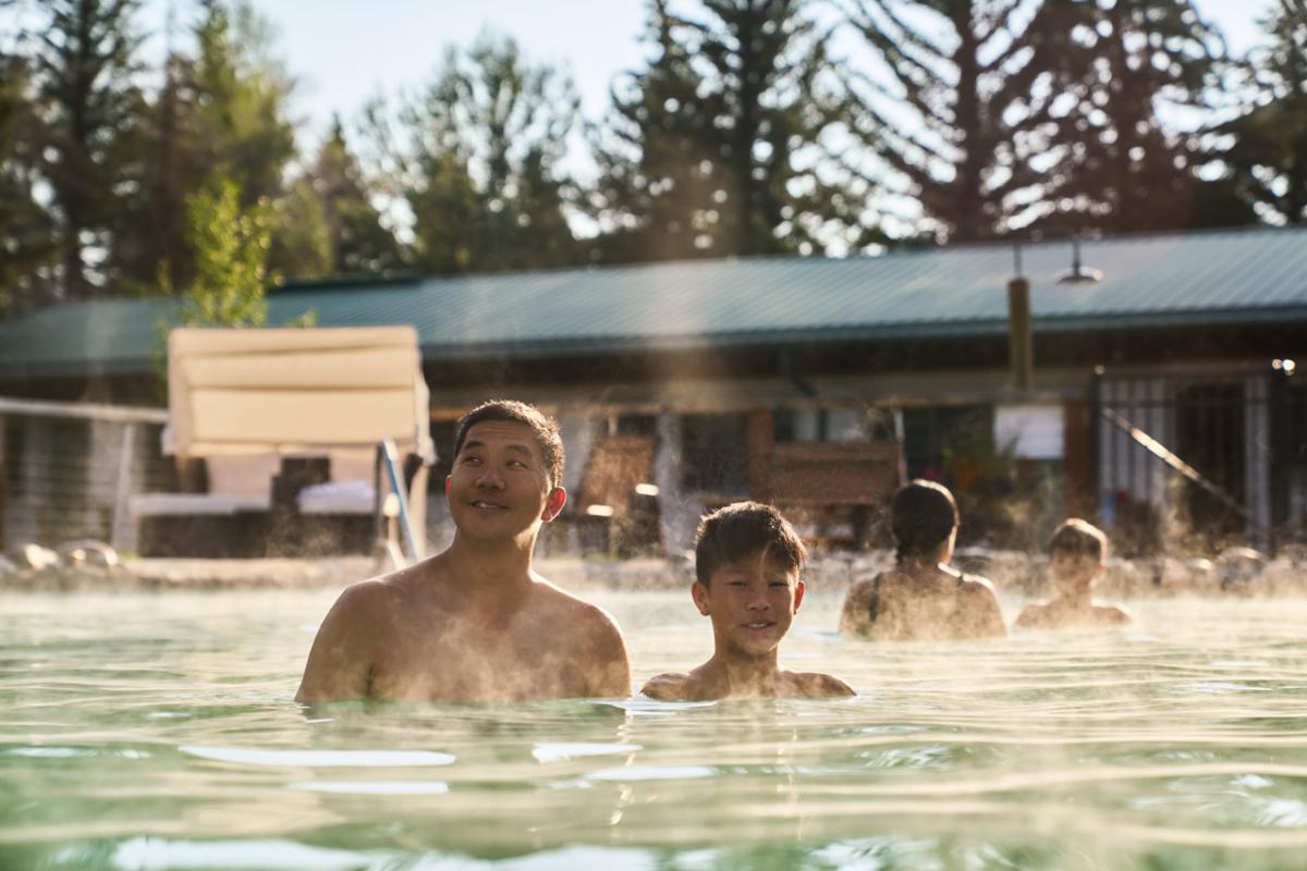 people soaking in warm water of hotsprings at a hotel