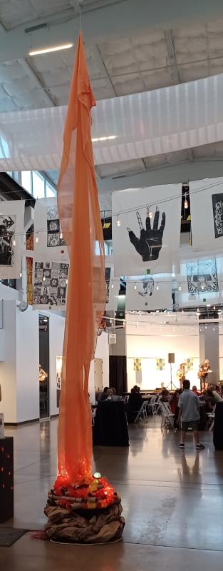 Tall art installation of a bonfire inside the Foundry Art Centre.