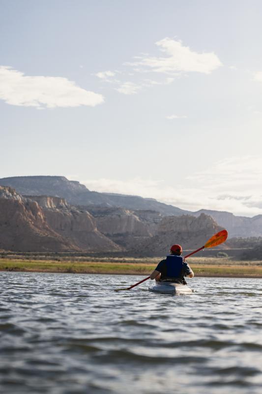 A kayaker on the water on Lake Abiquiu, near Ghost Ranch, New Mexico.