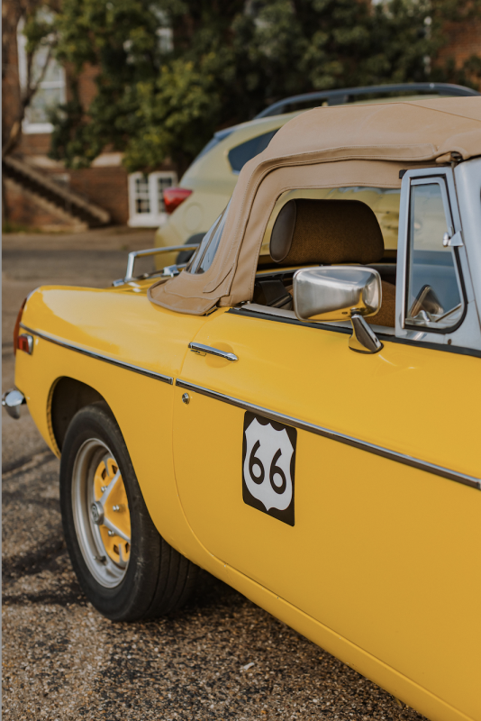 Classic yellow car with route 66 symbol at the Texas Route 66 Festival
