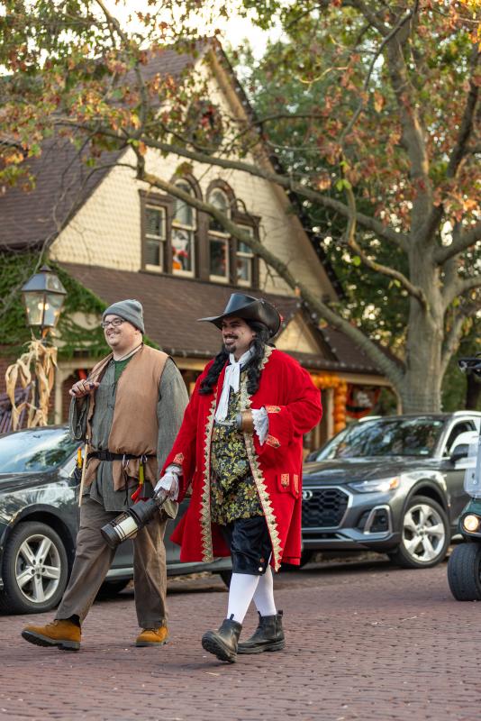Characters from Legends & Lanterns walk down Historic Main Street in St. Charles, MO.