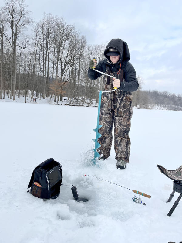 Tommy-O'Connell-drilling-hole-with-hand-held-ice-auger