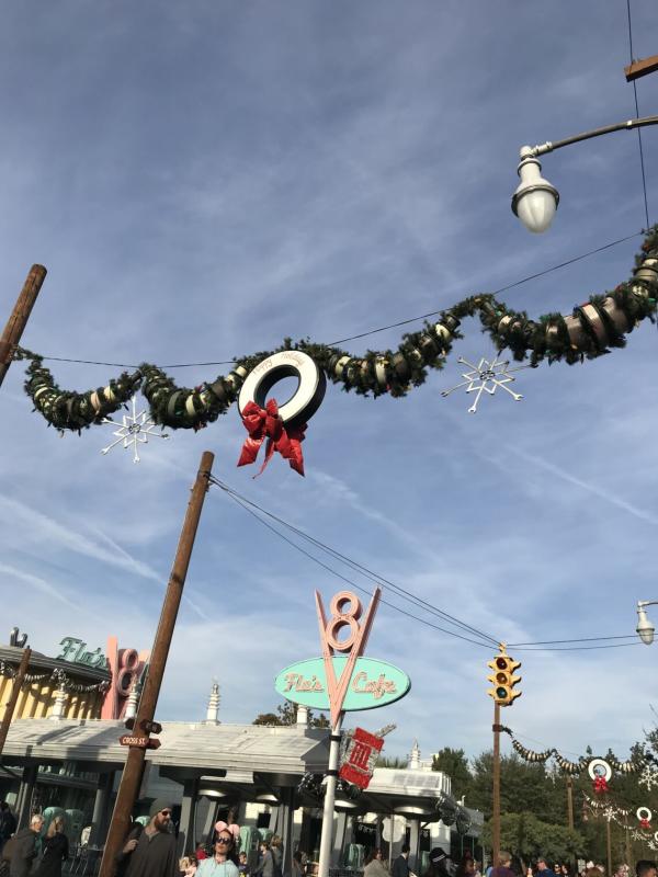 Image of tires in Cars Land decorated to look like Christmas decorations.