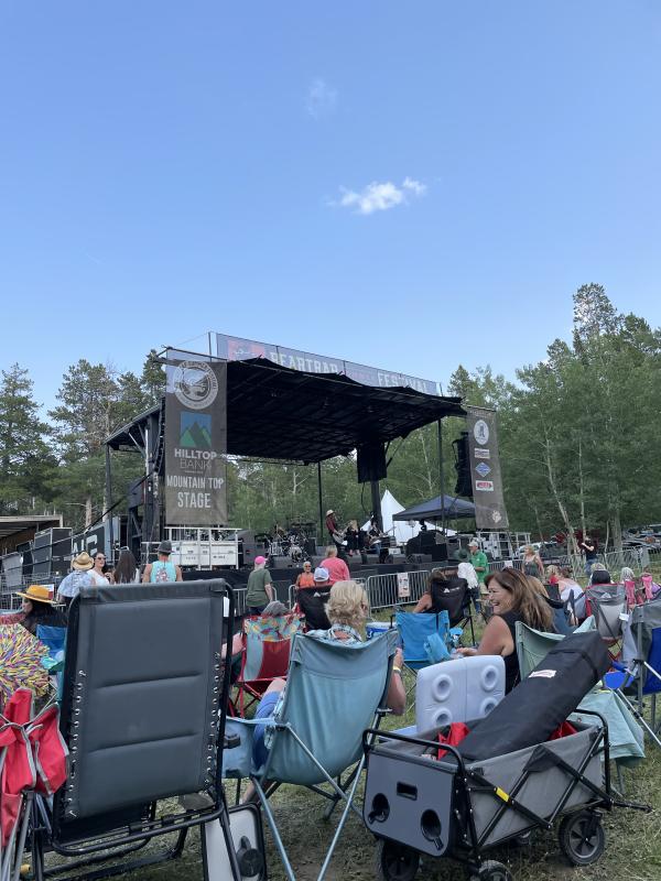 A crowd sitting outside at Beartrap Music Festival