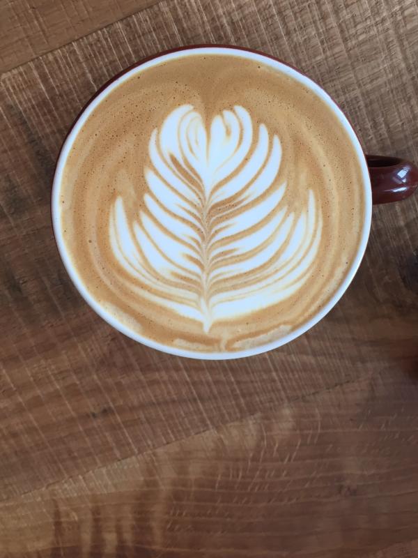 Cup of coffee with coffee art from Brioso Coffee