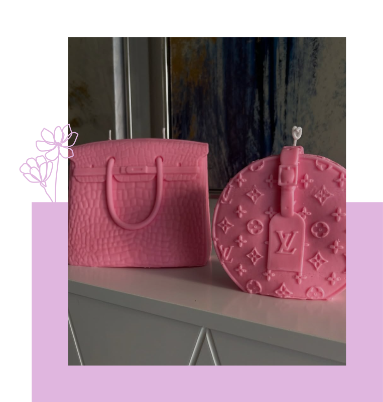 Two pink candles carved to look like designer handbags