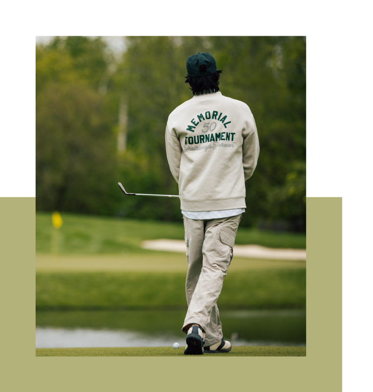 Golfer wearing jacket with Memorial Tournament logo on the back