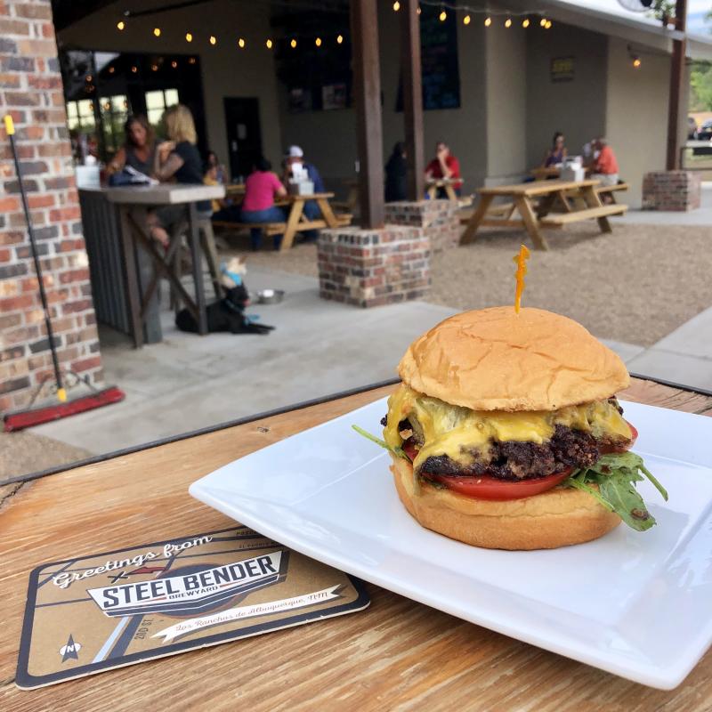 A photo of a cheeseburger at Steel Bender Brewyard.