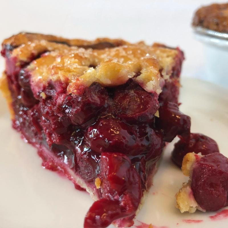 A close-up shot of a slice of cherry pie from Flying Star