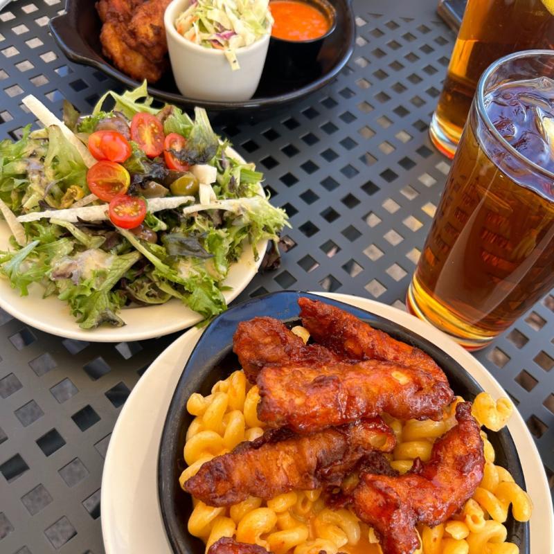 A salad, mac and cheese with chicken, and a drink from Flying Star Cafe