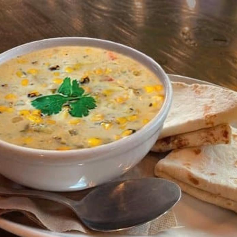 A bowl of Hatch green chile corn chowder from Flying Star Cafe