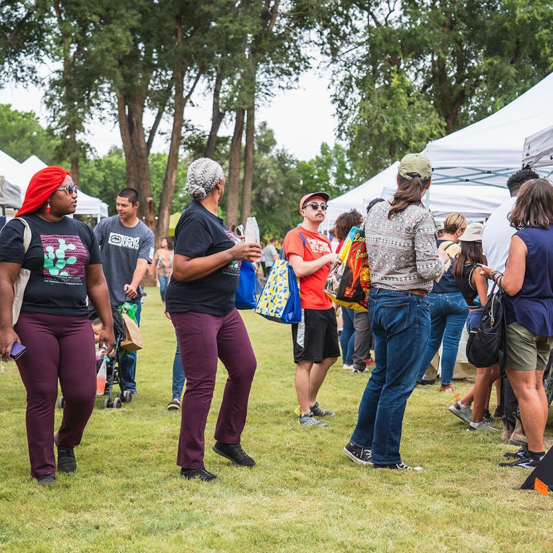 New Mexico Prickly Pear Festival attendees walk around browsing booths.