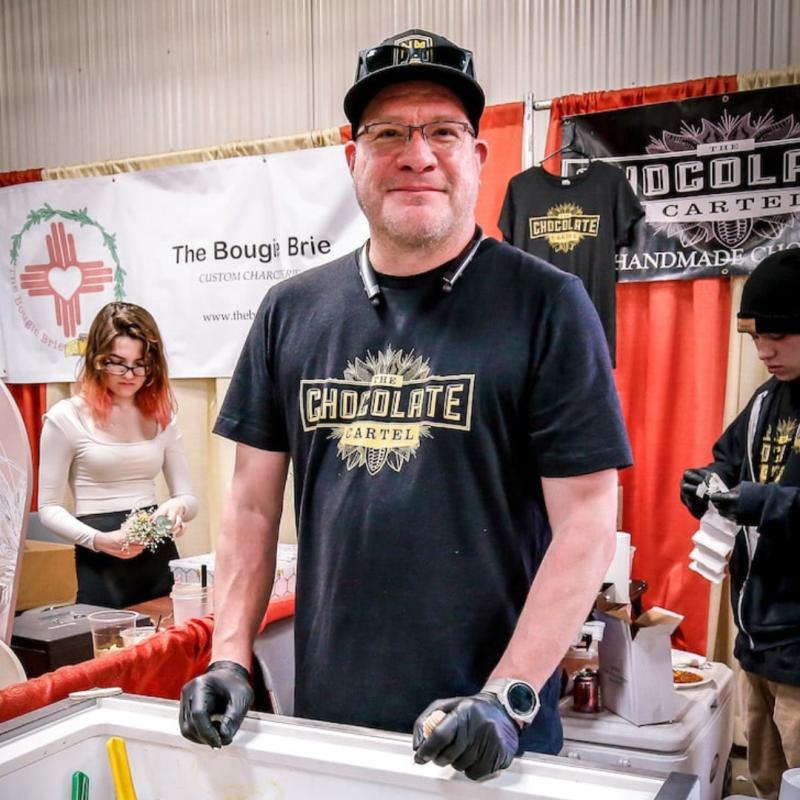 A Chocolate Cartel employee smiles at the Southwest Chocolate and Coffee Festival