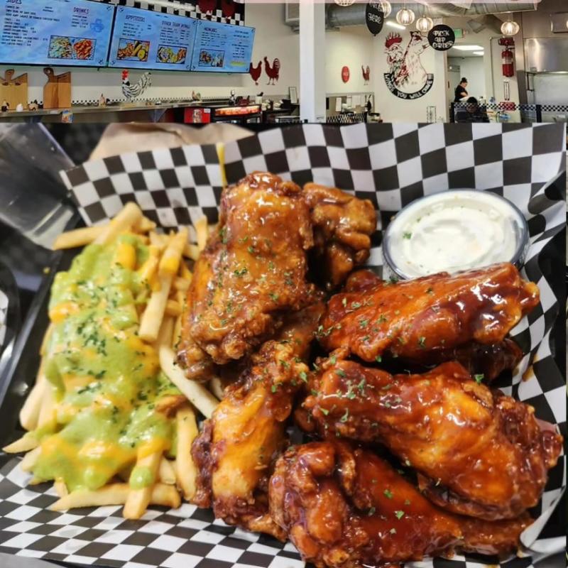 A plate of wings and french fries from Wing It Up