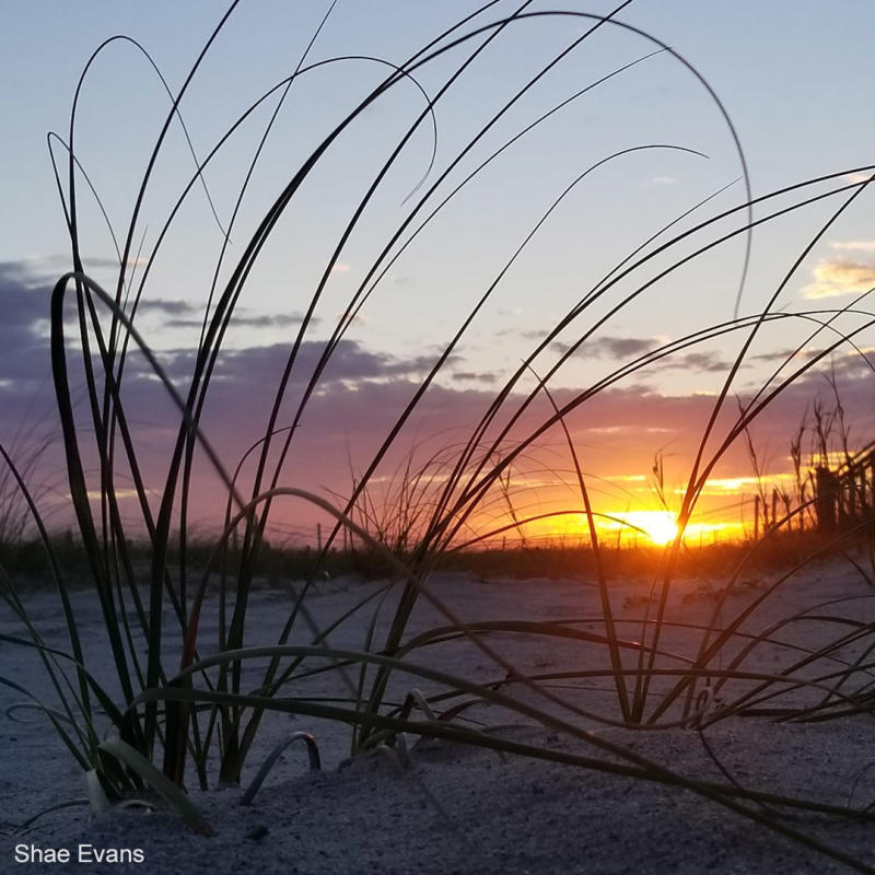 Sun setting over the ocean in Holden Beach, North Carolina.