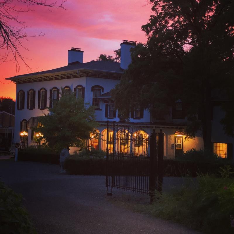 Sunset sky behind Maxwell Mansion