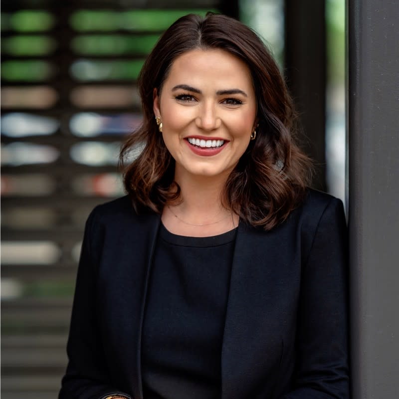 A photo of Brianna Francis wearing a blazer in a professional headshot.