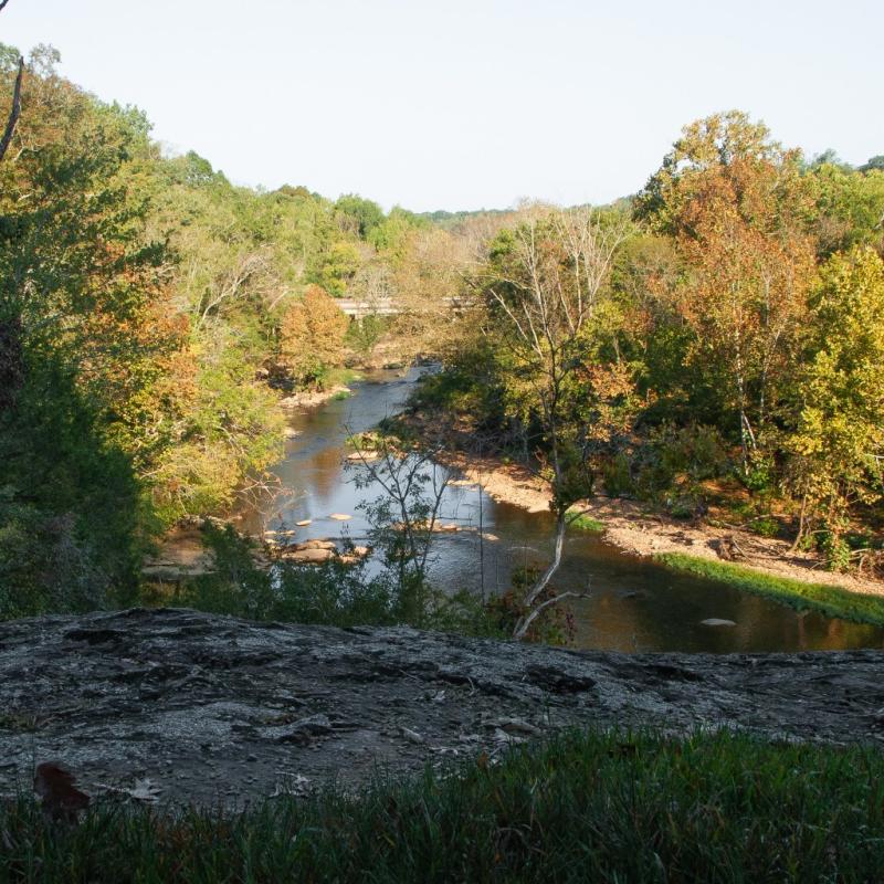 Deep river state trail access water and trees at faith rock