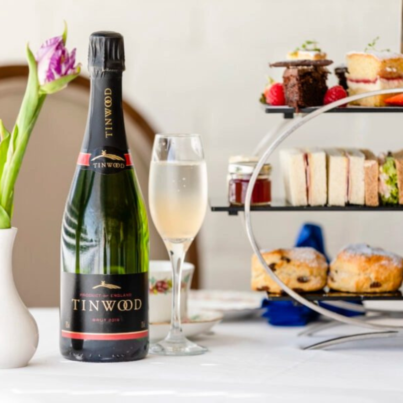 Tinwood afternoon tea with bottle of sparkling wine, sandwiches and cakes