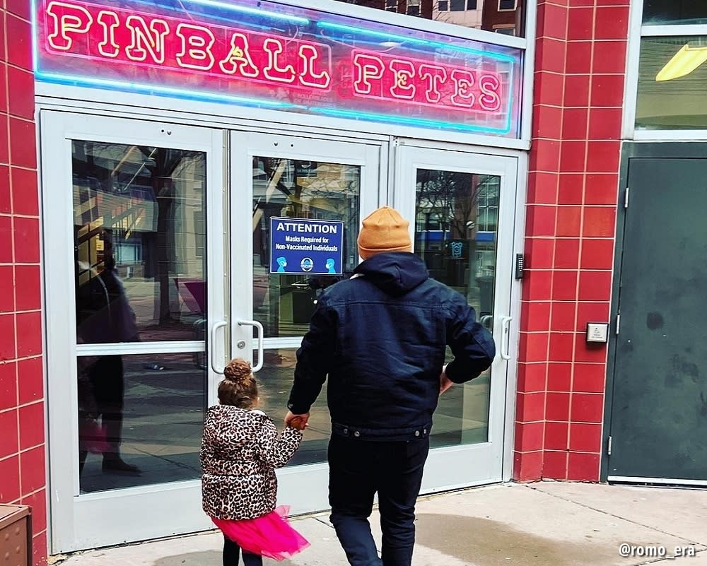 Dad and daughter walking into Pinball Pete's