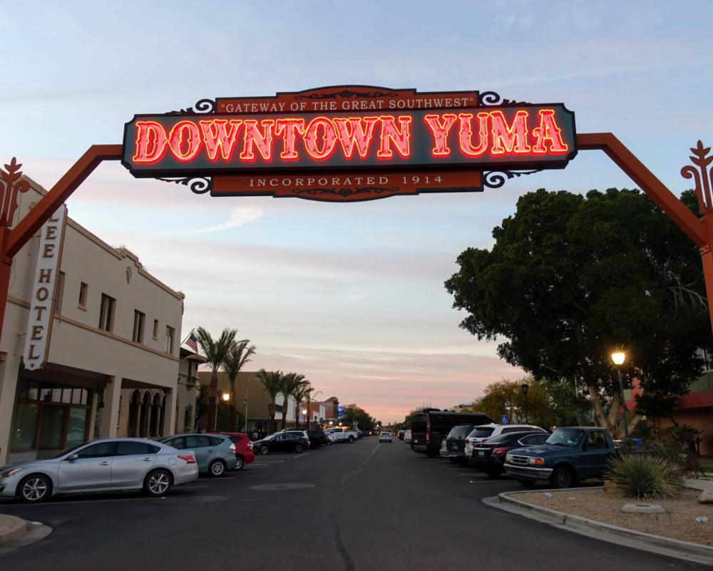 Downtown Yuma sign lit at twilight