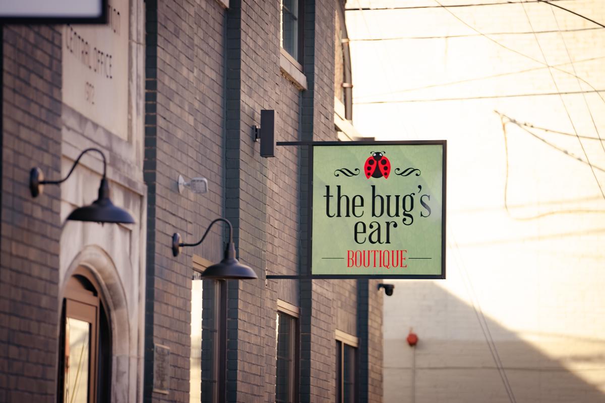 the bug's ear boutique sign outside the assembly building