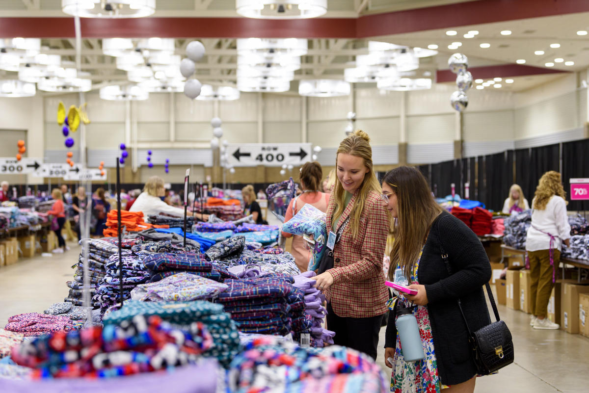 women shopping for handbags at the vera bradley annual outlet sale