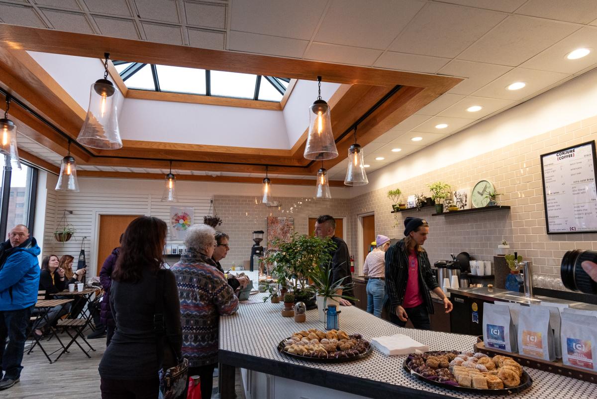 Individuals waiting in line for a coffee at Conjure Coffee located at the Botanical Conservatory in Fort Wayne, Indiana.