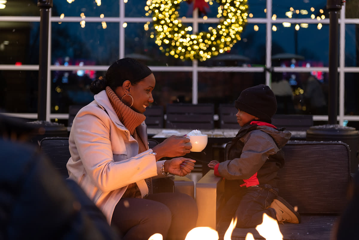 Mom and son drinking hot chocolate at the Clyde Club Room in Fort Wayne