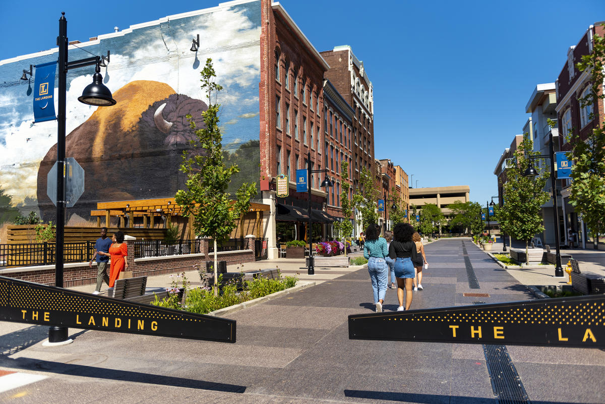 People walking along the pedestrian street on The Landing in Fort Wayne