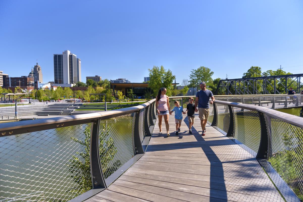 Family walking on the Tree Canopy Trail at Promenade Park