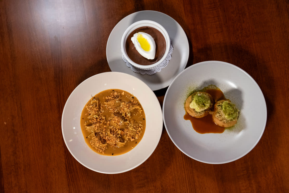 Three dishes of food at Rune restaurant showing pasta, stuffed mushrooms, and poached egg