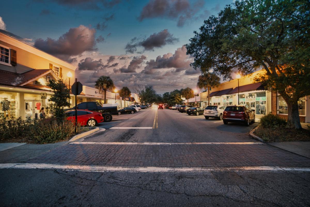 Street and shops at dusk in St. Simons Island Pier Village.