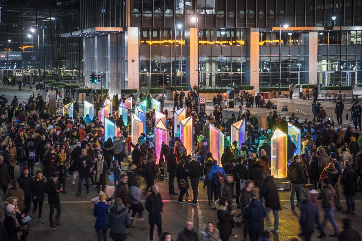 Visitors enjoy the lights of Prismatica at night