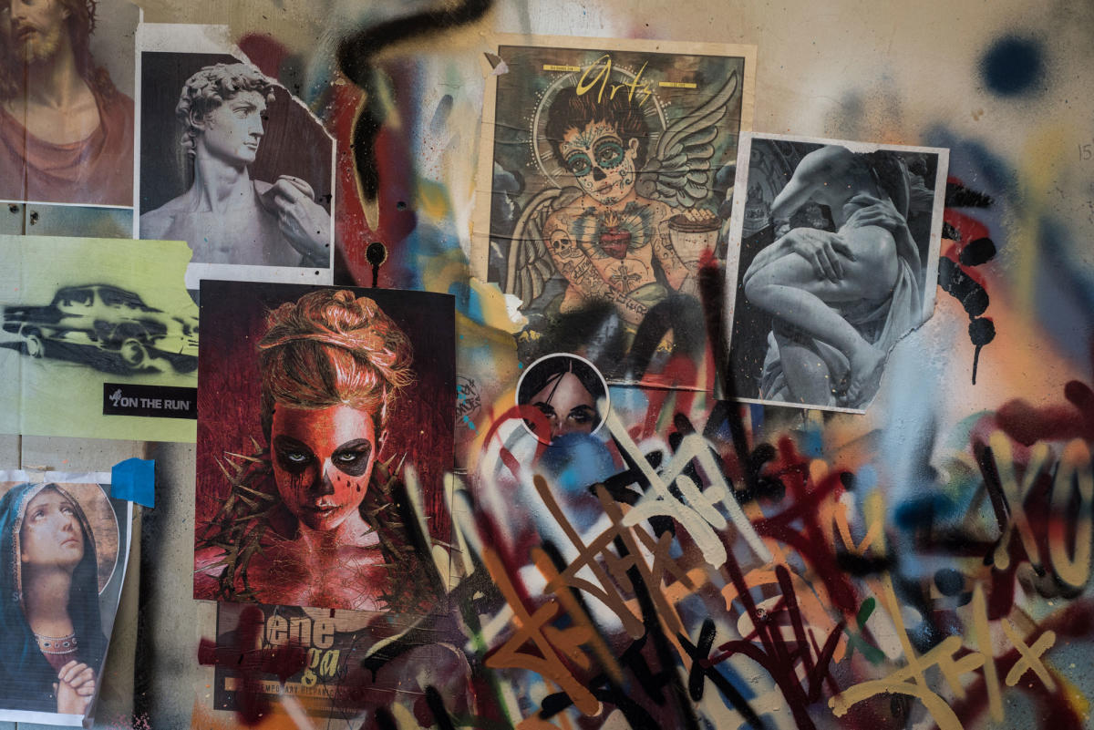 Vigil uses layers of stencils to paint images.