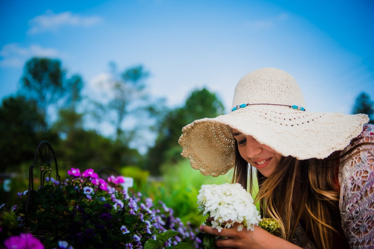 smelling flowers